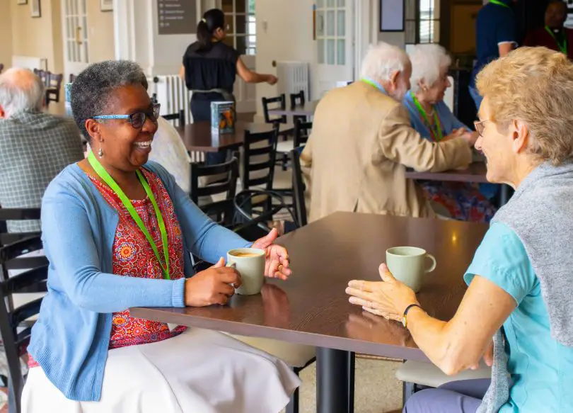 Visitors sitting together at a table