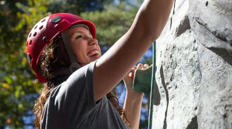 Young girl rock climbing