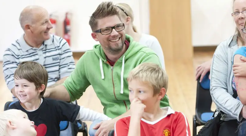 A group of parents and children having fun