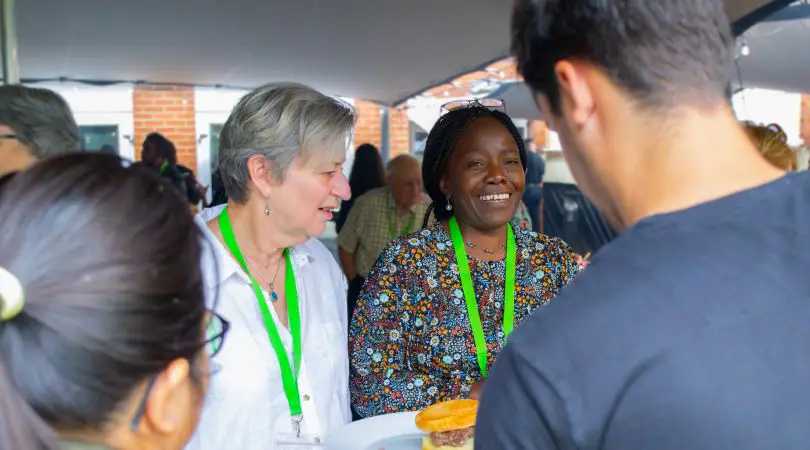 A group of people meeting outside