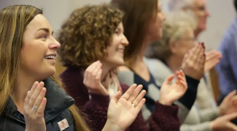 Small group of worshipers celebrating