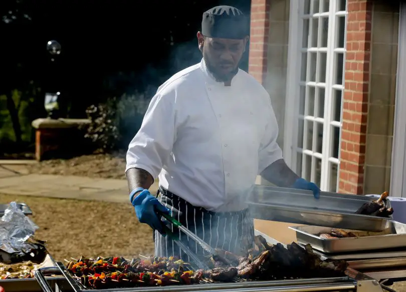Chef preparing a barbecue outside