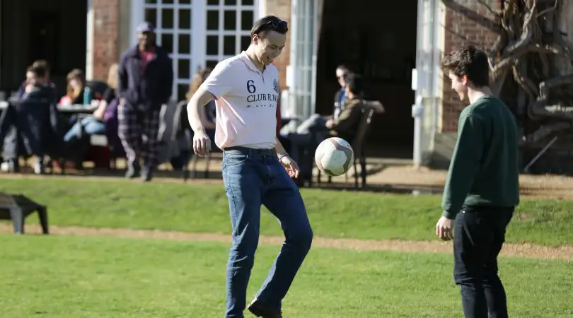 Visitors playing football in the garden