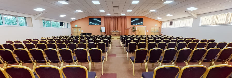 The inside of the Derbyshire Hall looking down the centre aisle of a theatre-style set up