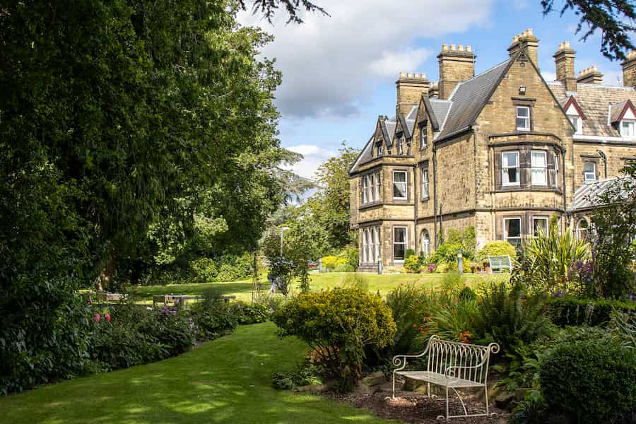 The Hayes centre in the sun with the stunning green gardens.