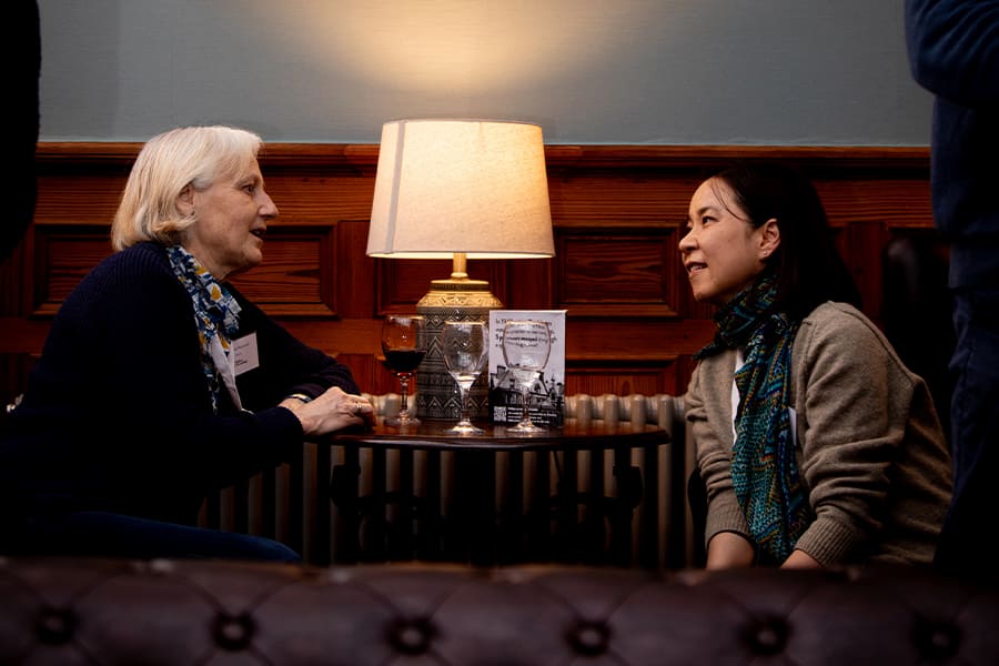 An older woman talking to a younger woman in the lounge at The Hayes