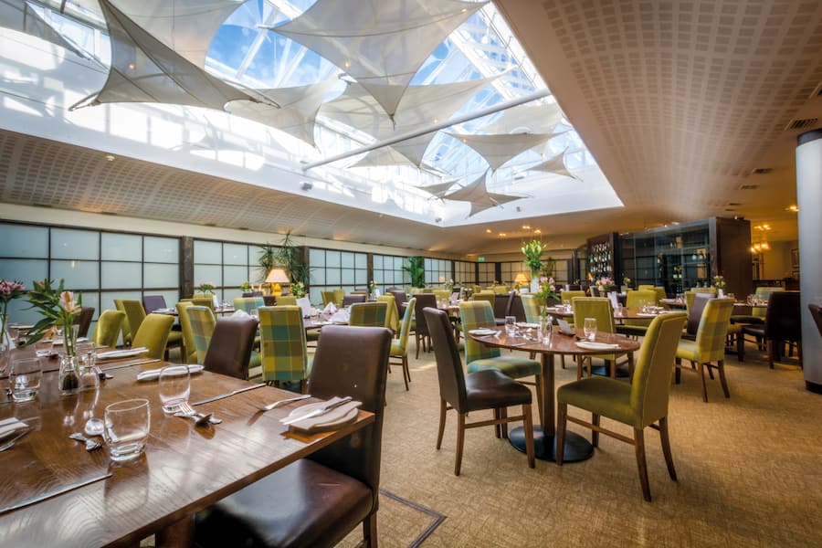 The dining room at Highgate showing it's premium quality with leather chairs and tasteful decor.