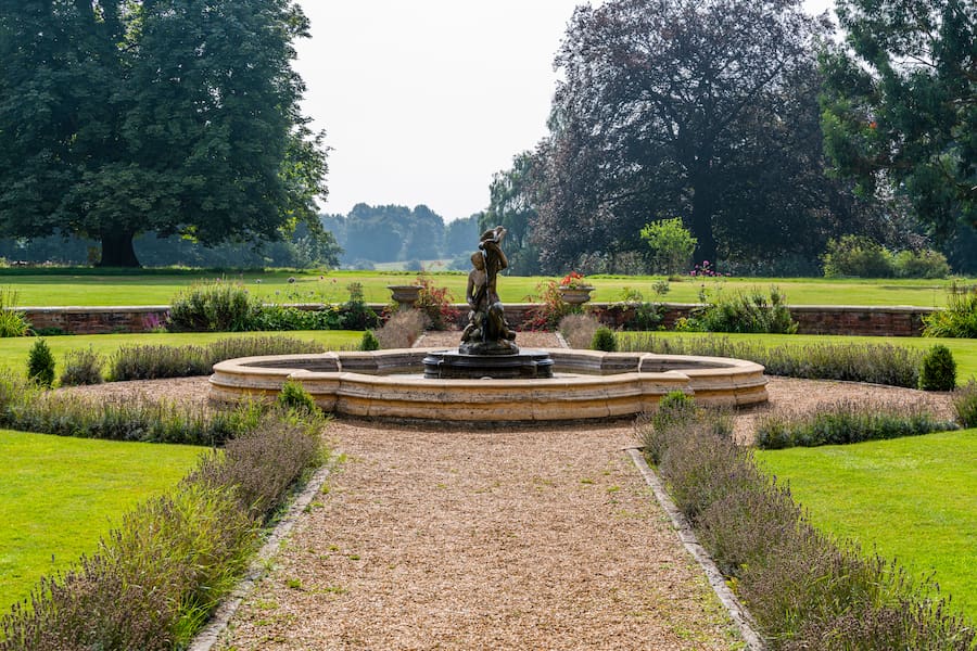High Leigh's grounds showing the fountain and gardens as well as the grassland that stretches far into the distance.