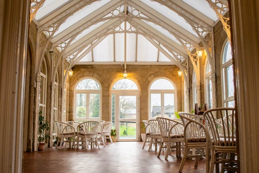 The Vinery before renovations showing the old chairs and decor.
