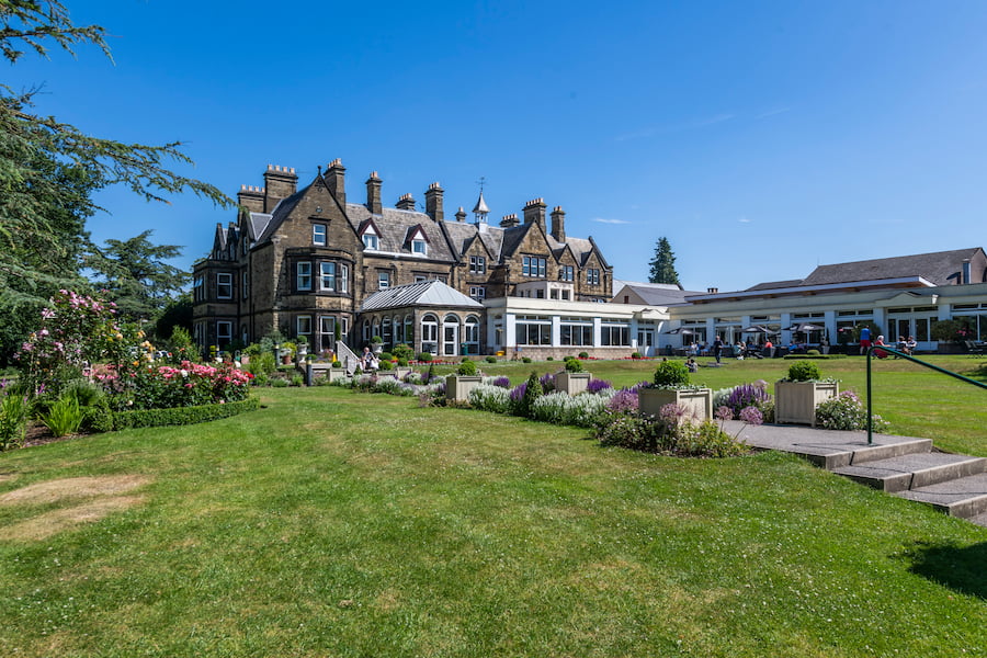 The Hayes main house lawn showing the house and the gardens,
