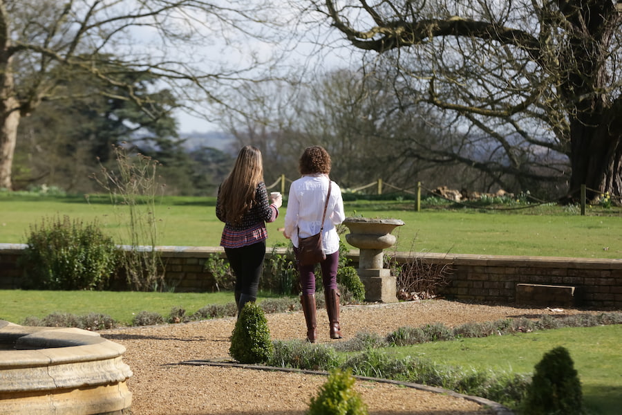 Two delegates walking in peace throughout the gardens of one our venues.
