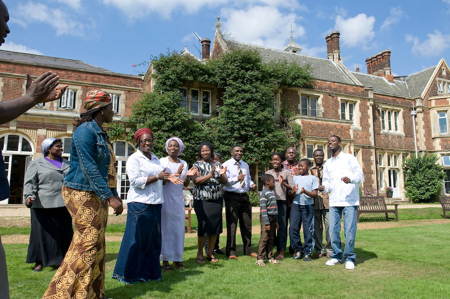 A group worshipping outside on a sunny day at one of our conference centres.