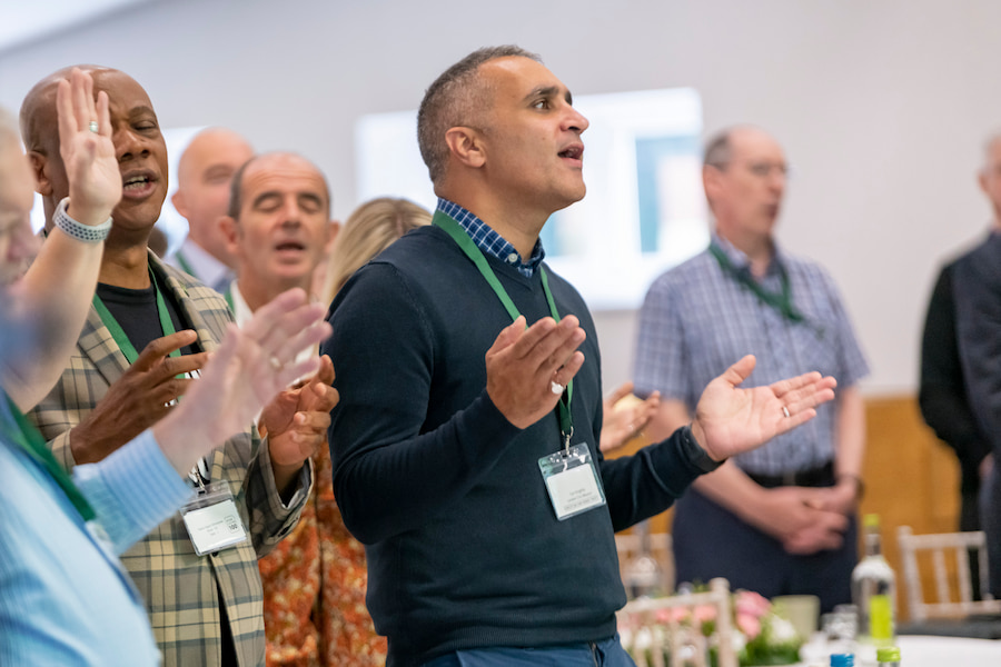 A man worshiping in one of High Leigh's meeting rooms.
