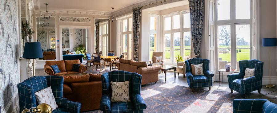 The Woodlands Lounge at High Leigh which overlooks the sunny grounds.