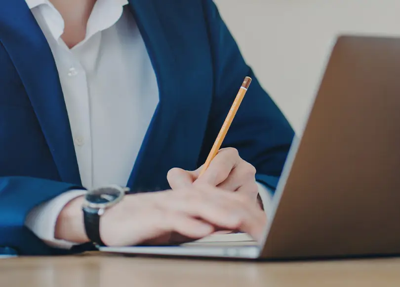Man watching a webinar on a laptop